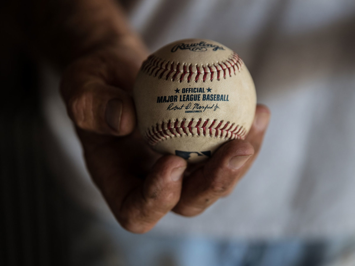 holding-baseball-mud.jpg